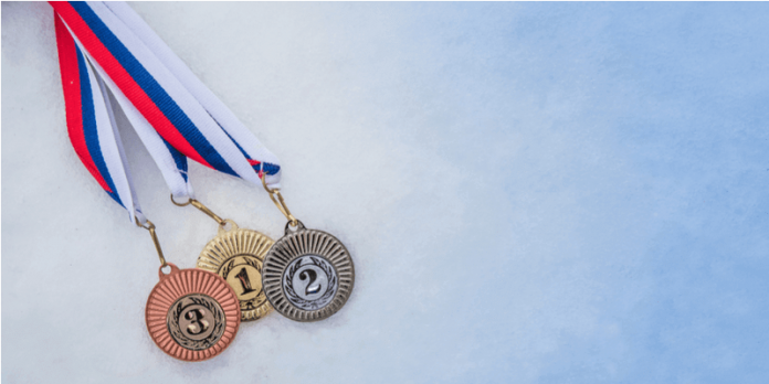 winter Olympic medals on ice