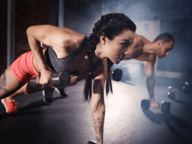 two people doing a push-up row