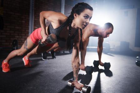 Photo of two people doing a workout