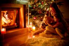 mother and children in front of fireplace