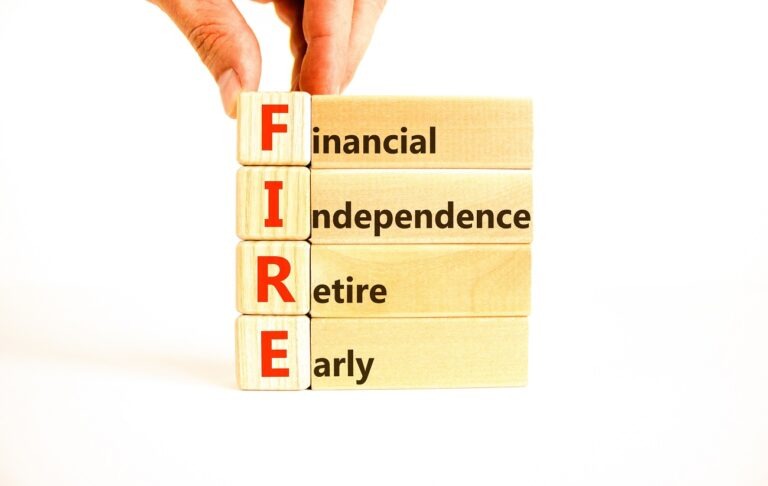 Toy blocks with the letters "FIRE" that say "Financial, independence, retire, early"